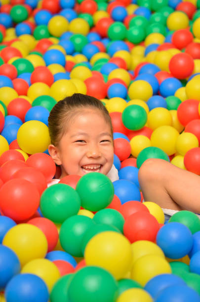 istock Girl's playing with balls 955186252