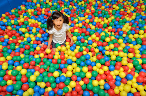 istock Girl's playing with balls 955186266