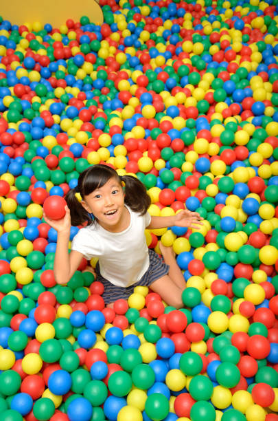 istock Girl's playing with balls 955186268