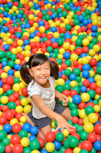 istock Girl's playing with balls 955186284