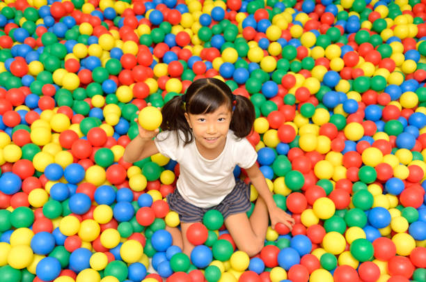 istock Girl's playing with balls 955186300