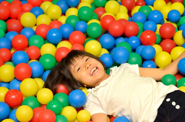 istock Girl's playing with balls 955186330