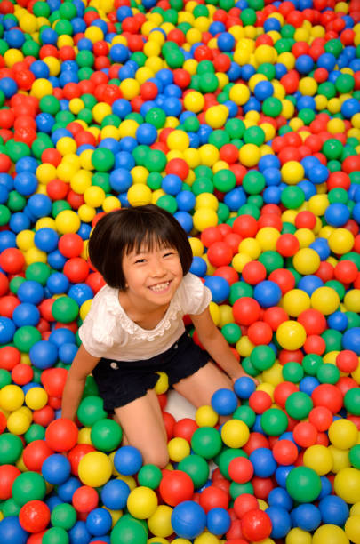istock Girl's playing with balls 955186370