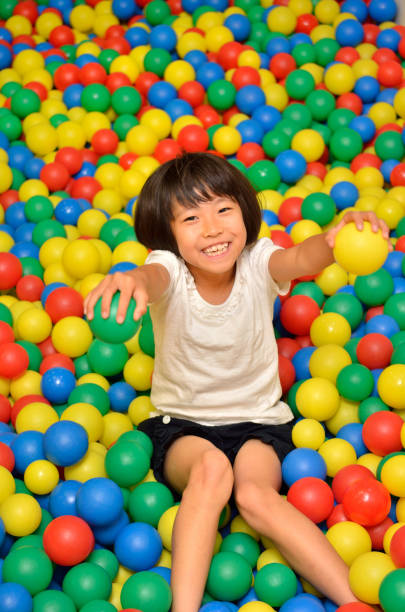 istock Girl's playing with balls 955186382