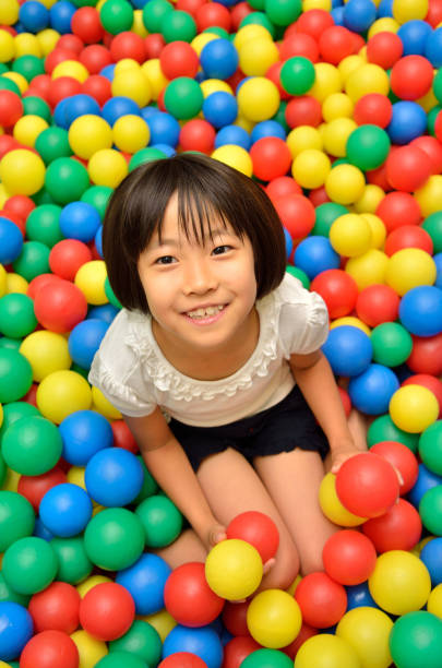 istock Girl's playing with balls 955186408