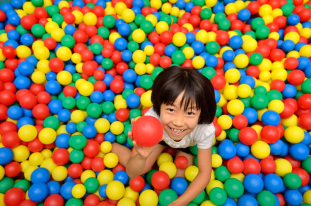 istock Girl's playing with balls 955186412