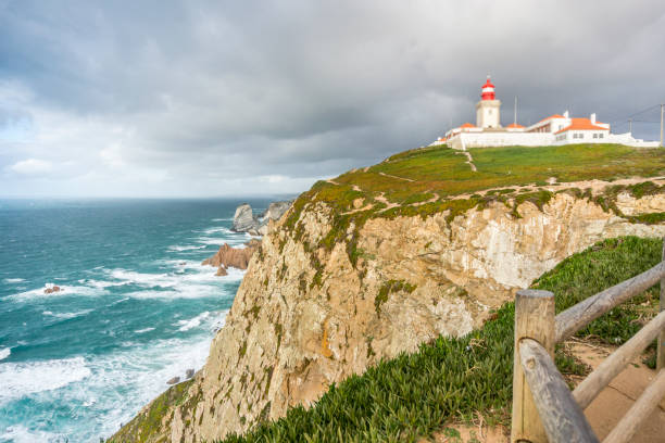 istock Lighthouse on the cliffs on Cape Roca, Sintra - Cascais Natural Park, Portugal 955186598