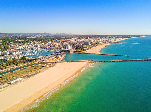Aerial view of  Vilamoura with charming marina and wide sandy beach, Algarve, Portugal