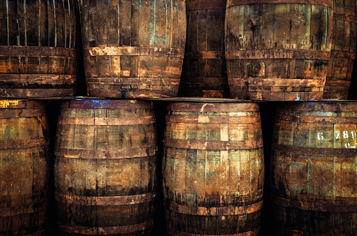 Stacked pile of old whisky barrels