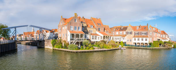 Houses and draw bridge in old town of Enkhuizen, Noord-Holland, Netherlands Panorama of houses and draw bridge in historic old town of Enkhuizen, Noord-Holland, Netherlands enkhuizen stock pictures, royalty-free photos & images