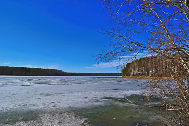 istock early spring, ice melts on the lake 955196368