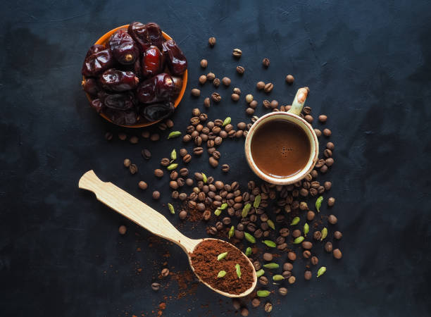 Black coffee with cardamom and dates. Traditional Arabic coffee.