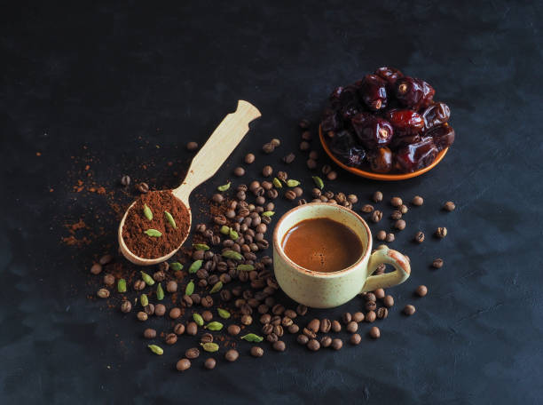 Black coffee with cardamom and dates. Traditional Arabic coffee.