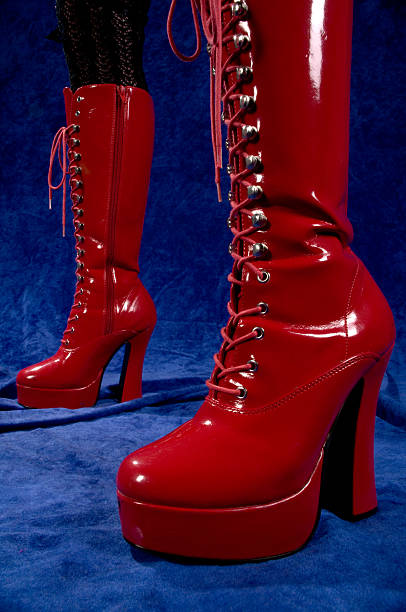 Shiny red platform boots.  dominatrix stock pictures, royalty-free photos & images