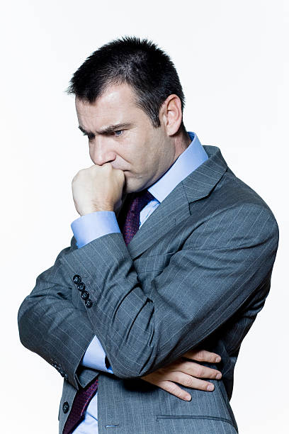 istock one anguish thinking pensive anxious business man 95521005