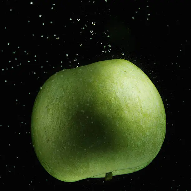 Photo of Green apple in water