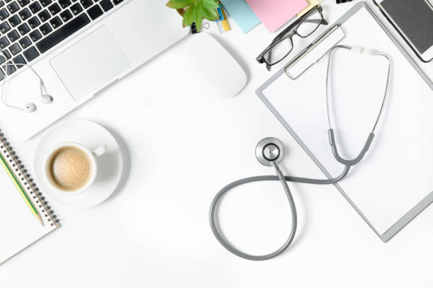 istock Top view of doctor desk table with stethoscope 955237758