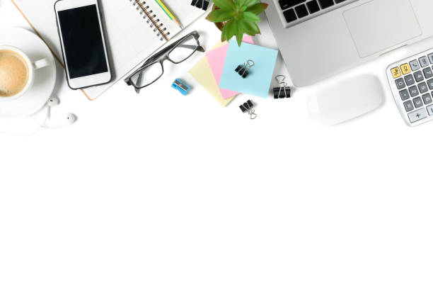 istock white office desk table with laptop, smartphone and supplies 955240470