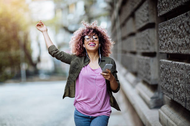 istock Walking and listening to music 955244618