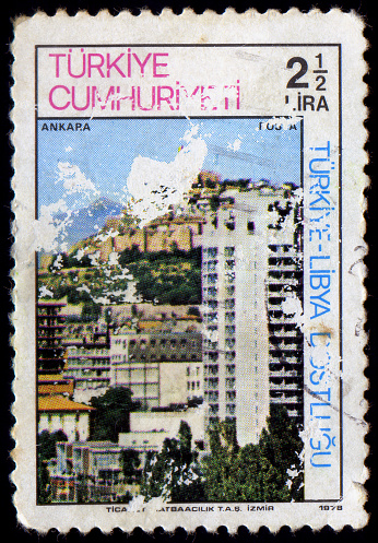old Chinese stamp with multi-level western classical architecture.