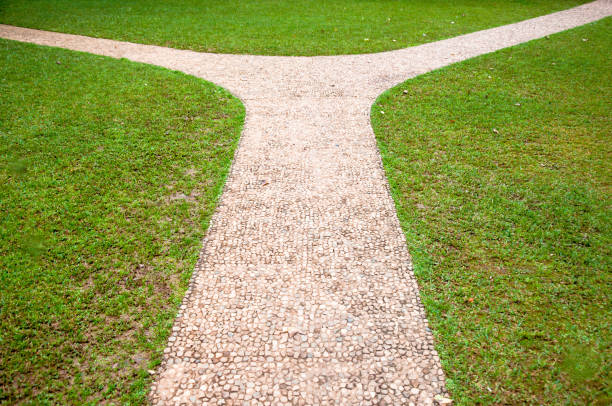 istock Crossroads, right or left two different direction, concept of choose the correct way. 955251930