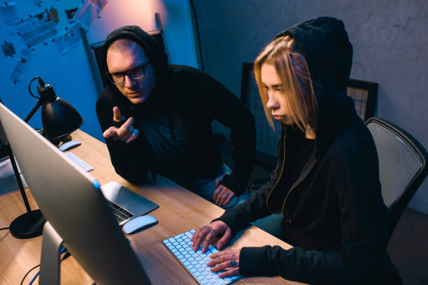 istock confident couple of hackers working on malware together 955255796
