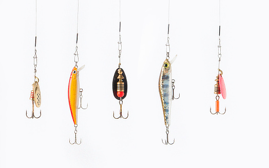 Fishing lures on white background.