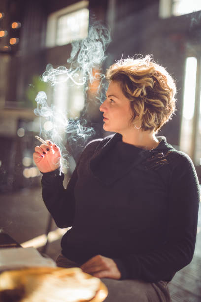 istock Woman smoking a cigarette 955268150