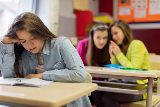 istock Teenage girls bully classmate 955268712