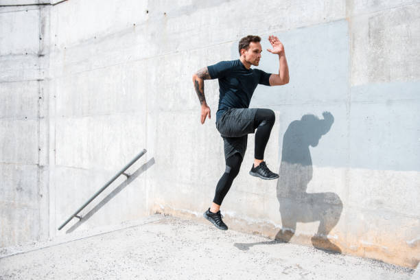 istock Man running and jumping on the stairs 955272196
