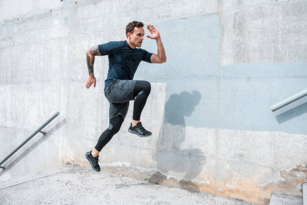 istock Man running and jumping on the stairs 955272214