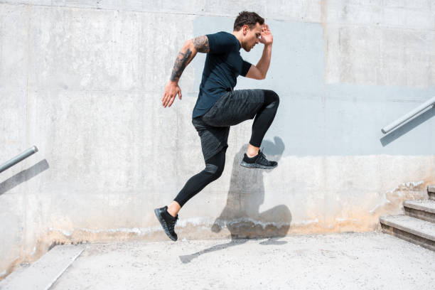 istock Man running and jumping on the stairs 955272220