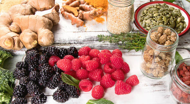 Various superfoods on white wooden board. Healthy food concept