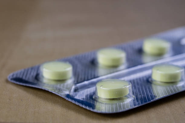 Pink antihistamine capsules in blister pack