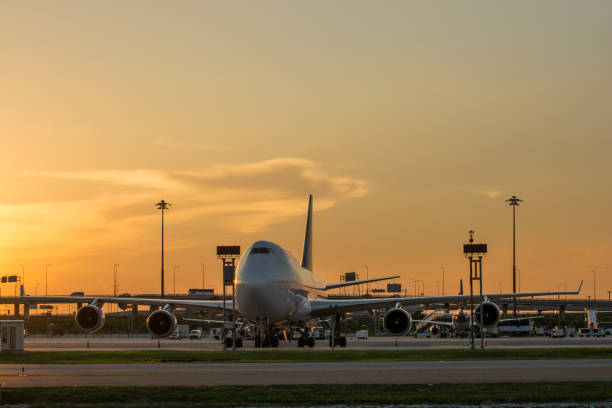 istock Airport airliner at dusk departure with control tower 955285970