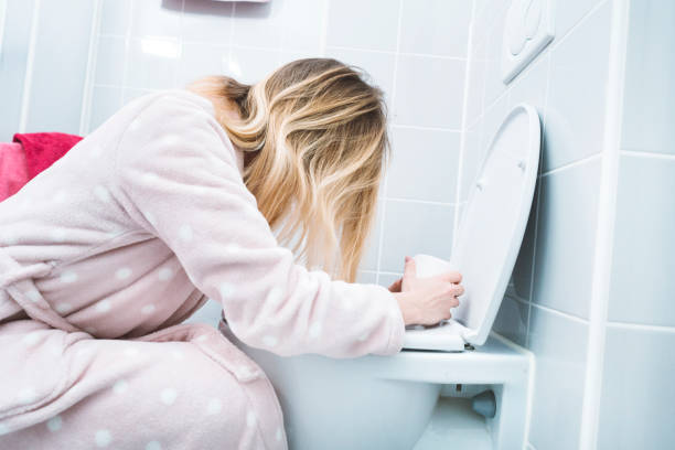 istock Girl throwing up after a night out 955287038