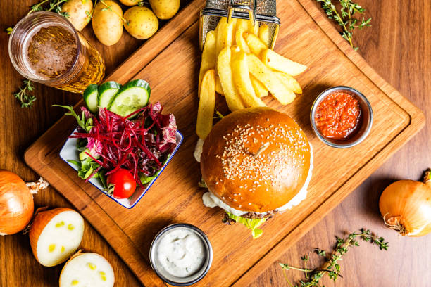Hamburger with salad and beer