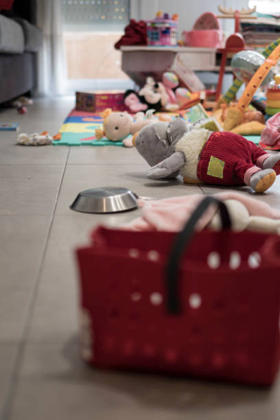 istock Many toys untidy on a grey floor indoor 955305324