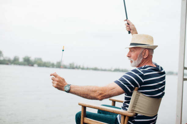 istock Man in retirement fishing 955306078