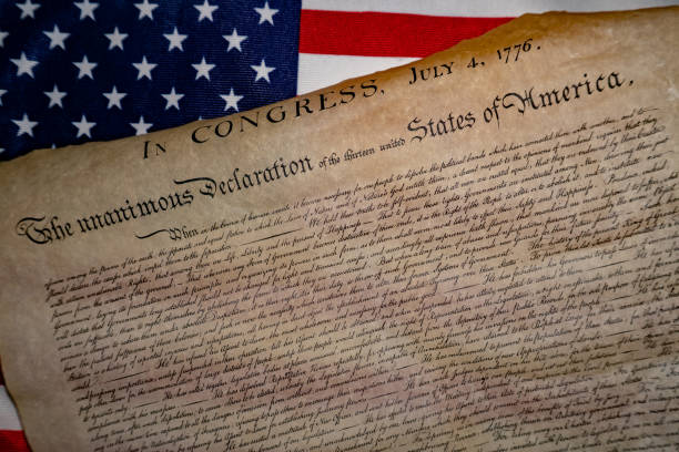 istock Declaration of independence 4th july 1776 on usa flag 955308932