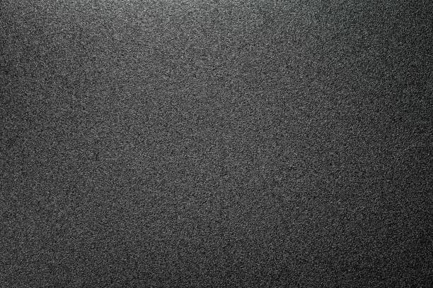 istock homogeneous matt texture of the tin surface, dark grey background 955322950