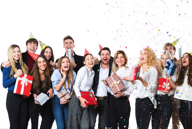 istock Group of attractive young friends standing over white background. 955328776