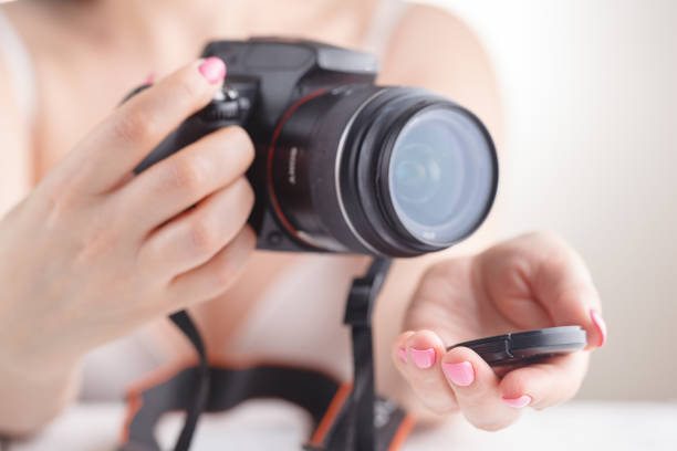 istock Female hold SLR photo camera in hands 955331082