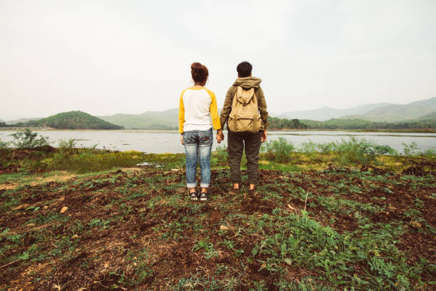 istock People stood overlooking the mountains and rivers happy holiday. 955338052