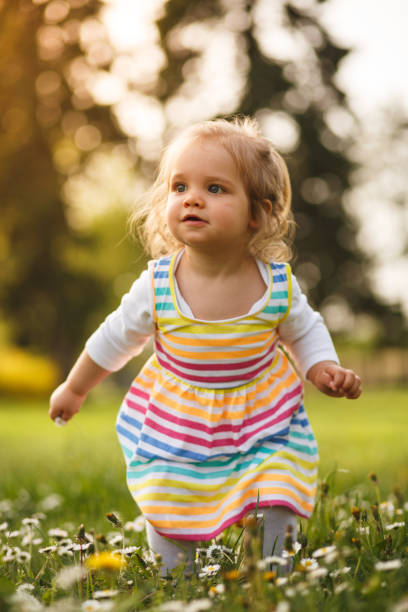 istock Playful girl in a park 955342064