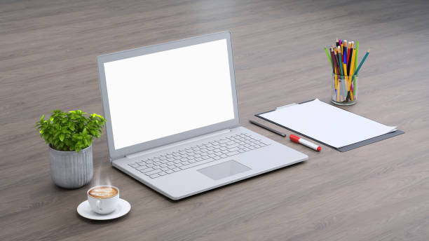 istock Laptop on a desk with accessories, blank screen mock-up isometric 955345870