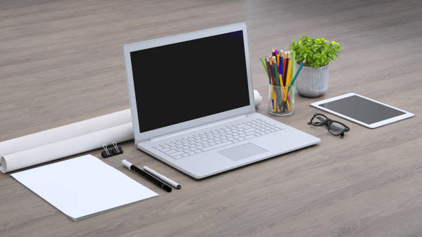 istock Laptop on a desk with accessories, blank screen mock-up isometric 955345878