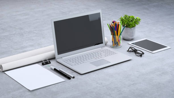 istock Laptop on a desk with accessories, blank screen mock-up isometric 955345888