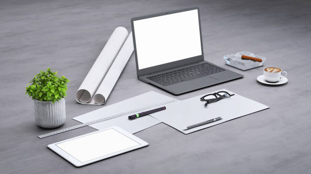 istock Laptop on a desk with accessories, blank screen mock-up isometric 955345950