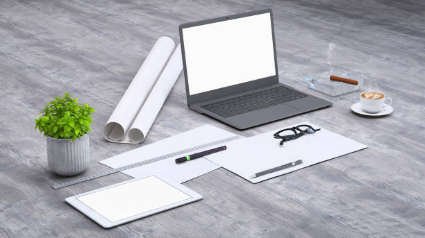 istock Laptop on a desk with accessories, blank screen mock-up isometric 955345960